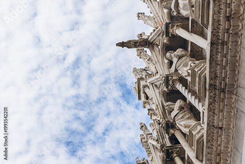 Картината върху платно Pisa Baptistery ornate marble Gothic architecture contrasting with a blue cloudy