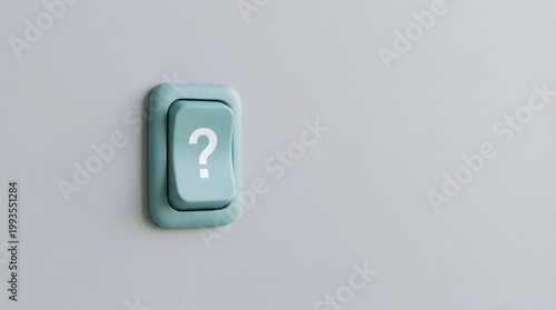 Close-up of a light teal push button with a white question mark symbol for 'uncertainty' or 'help'.