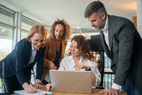 Diverse business team collaborating on new project using advanced AI technology for startup success