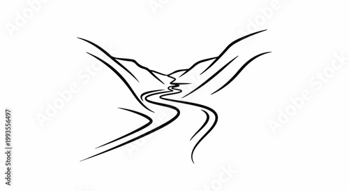 A winding road curves through a mountainous valley under a clear sky
