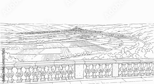 Ornate railing overlooks patchwork of rural fields and distant village