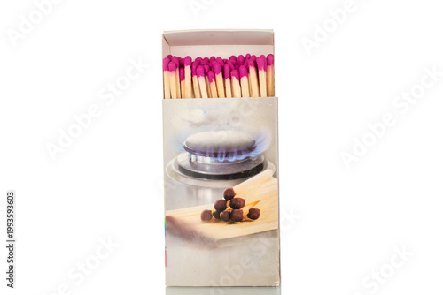 Wooden matches in paper boxes isolated on white background, close-up.