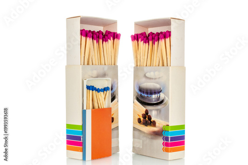 Wooden matches in paper boxes isolated on white background, close-up.