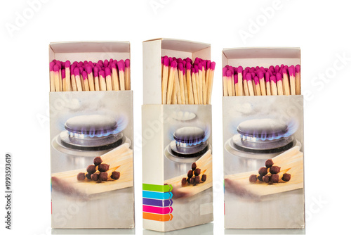 Wooden matches in paper boxes isolated on white background, close-up.