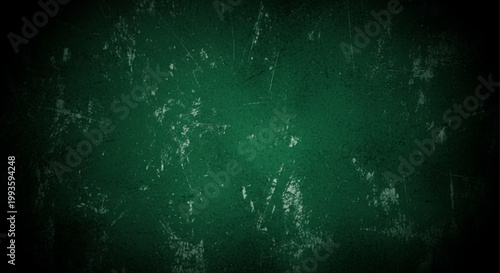 A dark green chalkboard texture with subtle scratches and light reflections.