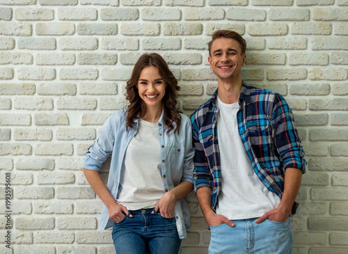 Smiling couple posing together.