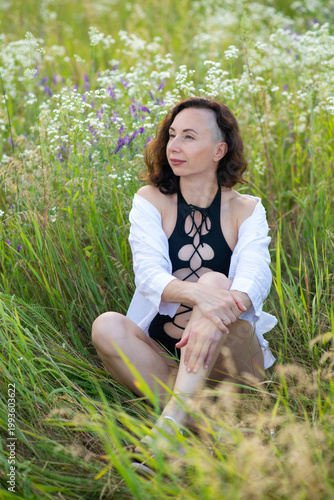 Woman Relaxing in Wildflower Meadow