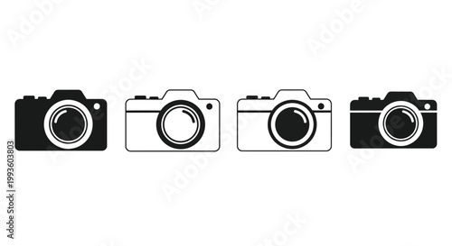 Four black and white retro cameras lined up next to each other