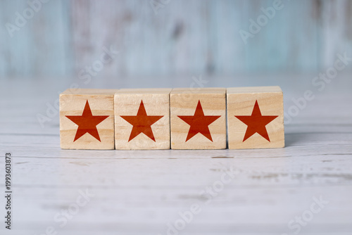 Customer Satisfaction Rating with Stars on Wooden Blocks