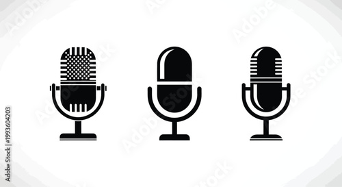 Three black and white microphones on a plain background