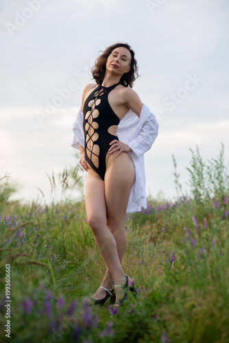 Woman in Cutout Swimsuit Posing in Wildflower Field
