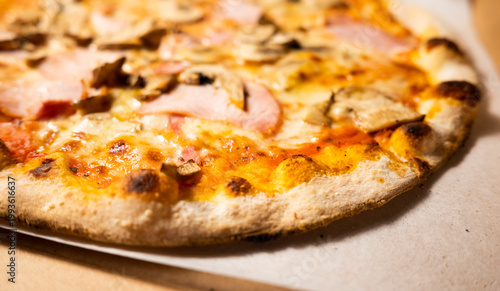 Meat and Mushroom Pizza with Melted Cheese, Homemade Comfort Food Close-Up