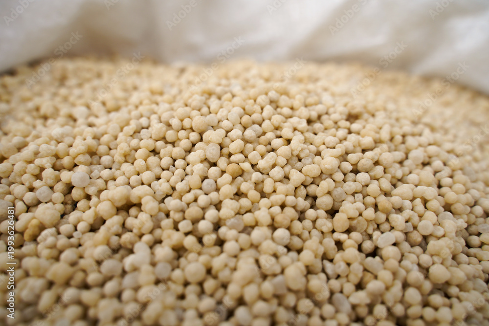 Fototapeta premium Ammonium nitrate. Background or texture. Selective focus. Nitrogen fertilizers as a component of plant nutrition. 