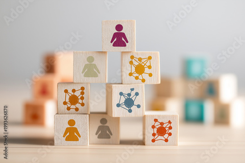 Organizational network structure with connected people icons on wooden blocks, showing team collaboration, stakeholder mapping, social graph, and business communication on a light background