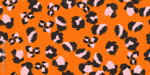 A seamless vector leopard pattern in black, pink on vibrant orange background with hand-painted brushstroke spots