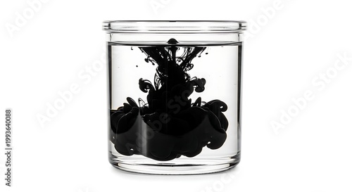 Black Ink Dissolving in Clear Water Inside a Glass Jar.