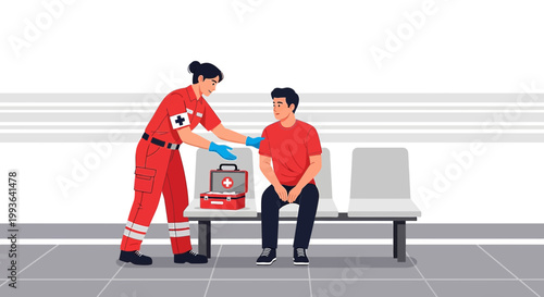 Paramedic checks on seated patient in waiting room, first aid kit nearby