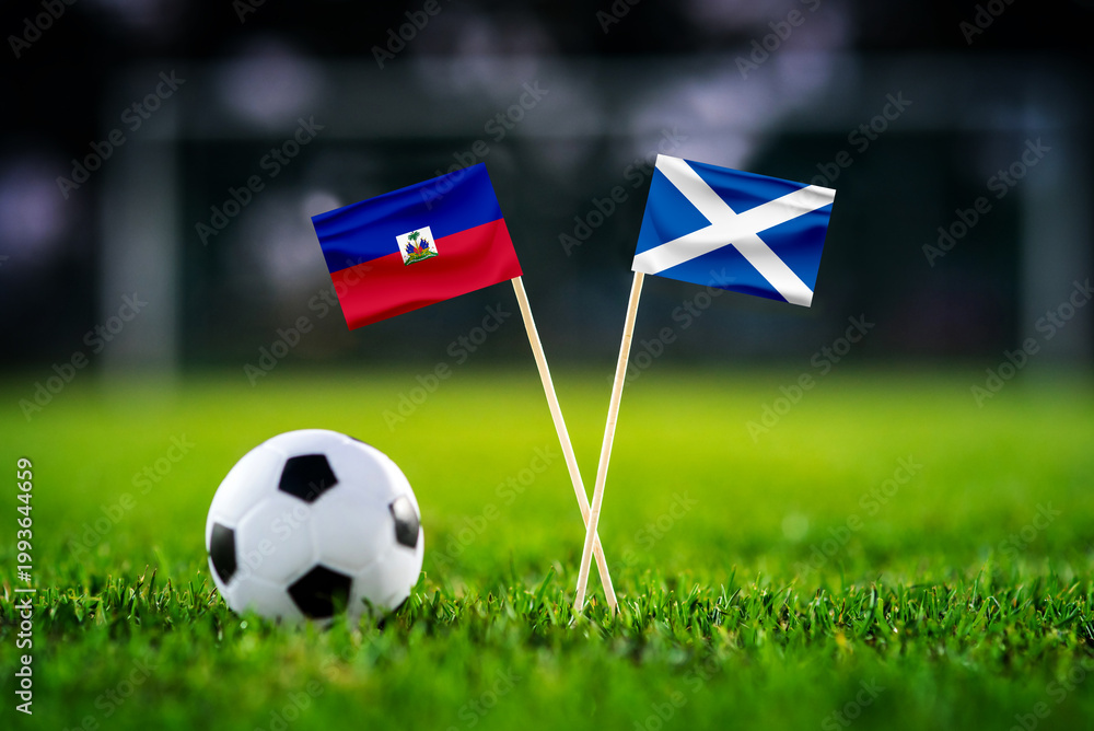 Fototapeta premium Haiti vs Scotland, national flags before world championship Group C group stage match, football on green pitch with goal in the background, Foxborough, USA, June 13, 2026