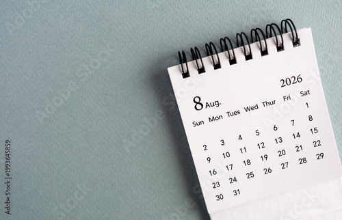 Hello August, desk calendar for planning for August 2026 on the table. 