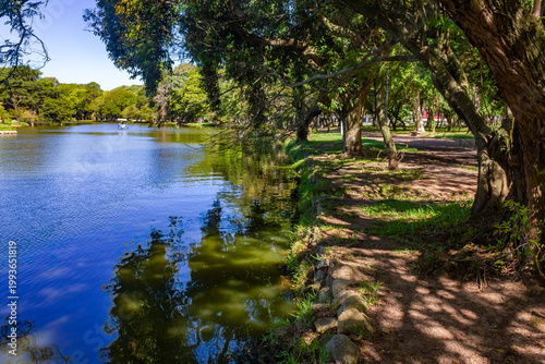 Lake and lush trees at Redencao Park in Porto Alegre, Brazil