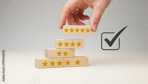 Hand placing wooden block with five yellow stars five star rating