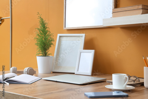 Laptop with blank frames an...