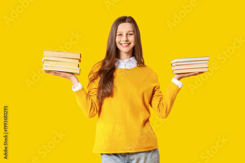 Young woman with stacks of ...