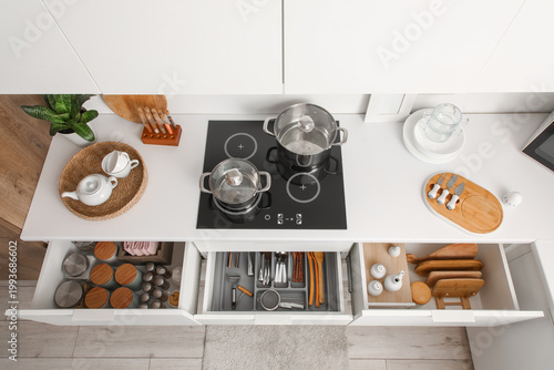 Opened kitchen drawers of u...