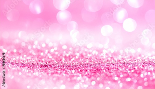 Pink glitter surface with sparkling bokeh light reflections close-up