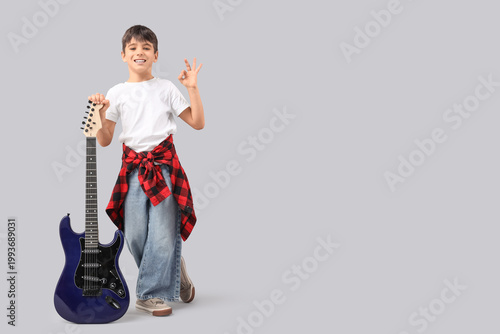 Cute boy with electric guit...