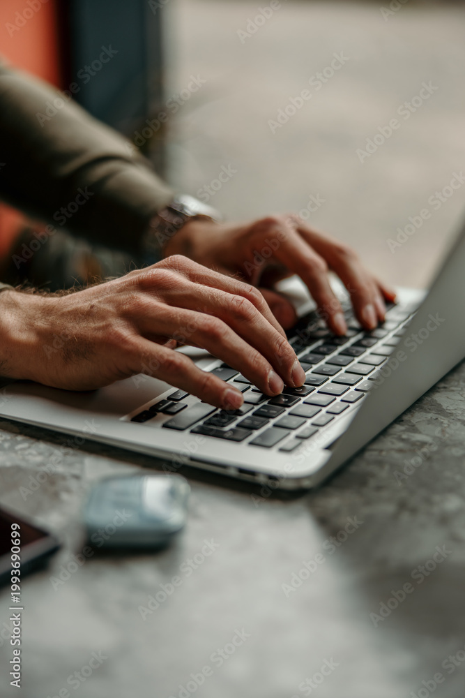 Obraz premium Hands typing on laptop keyboard working remotely