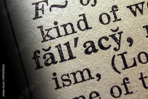 Photography Word fallacy printed on dictionary page, macro close up