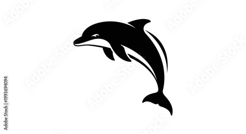 A sleek black and white silhouette of a dolphin leaping gracefully out of the water, captured in a dynamic and elegant pose.