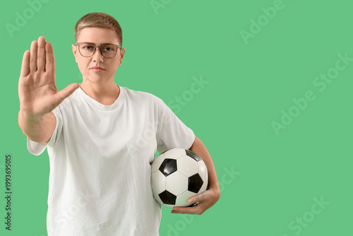 Female soccer fan with ball...
