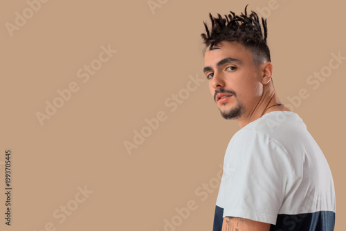 Young man with dreadlocks o...