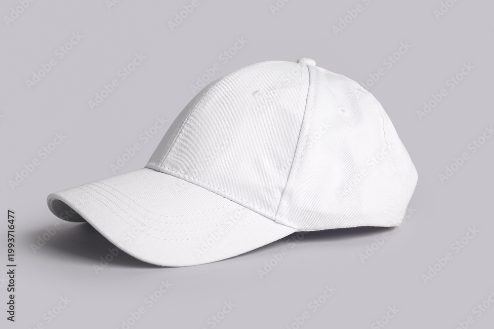 Fototapeta premium Blank white cap on grey background