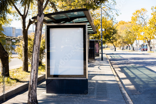 Fotografie Vertical blank billboard at a bus stop shelter in Buenos Aires, Argentina, during autumn season