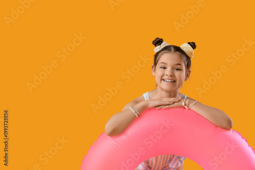 Smiling little girl with pi...