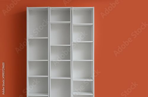 Empty white bookshelf near ...
