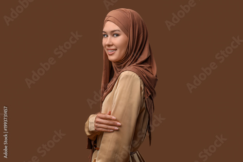 Happy young Muslim woman in...