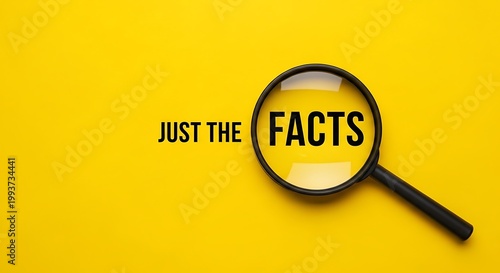 Magnifying glass focused on the words just the facts