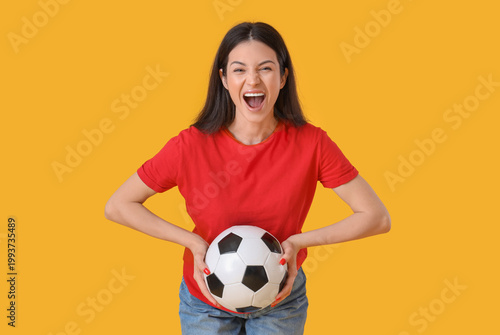 Happy young woman with socc...