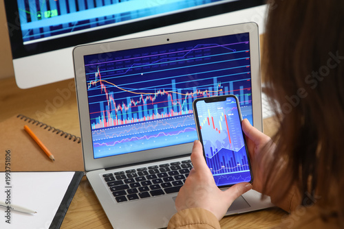 Female trader working with ...