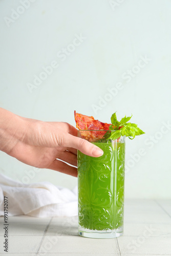 Female hand holding glass o...
