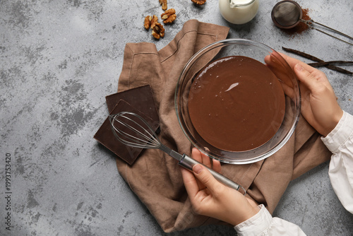 Female hands with whisk and...