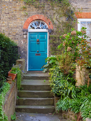 Traditional wooden door and front garden of terraced house in, Hampstead, London, UK