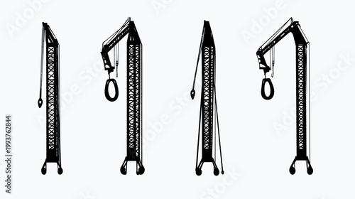Four black and white construction cranes on a white background, in various views