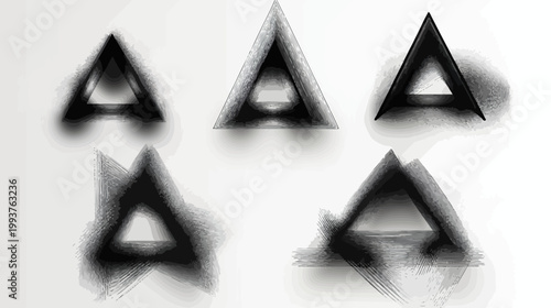 Abstract black and gray triangles, textured, on white background, multiple perspectives