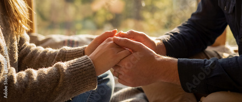 support comfort care holding hands empathy warmth cozy home connection sunlit hands gently clasped together show healing and emotional closeness for therapy wellness and comforting home themes