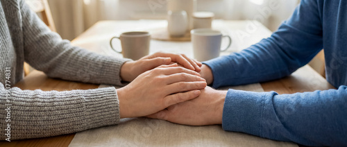 support comfort care holding hands empathy warmth cozy home connection supportive handholding on a sofa conveys patience trust and emotional closeness for therapy wellness and comforting home themes